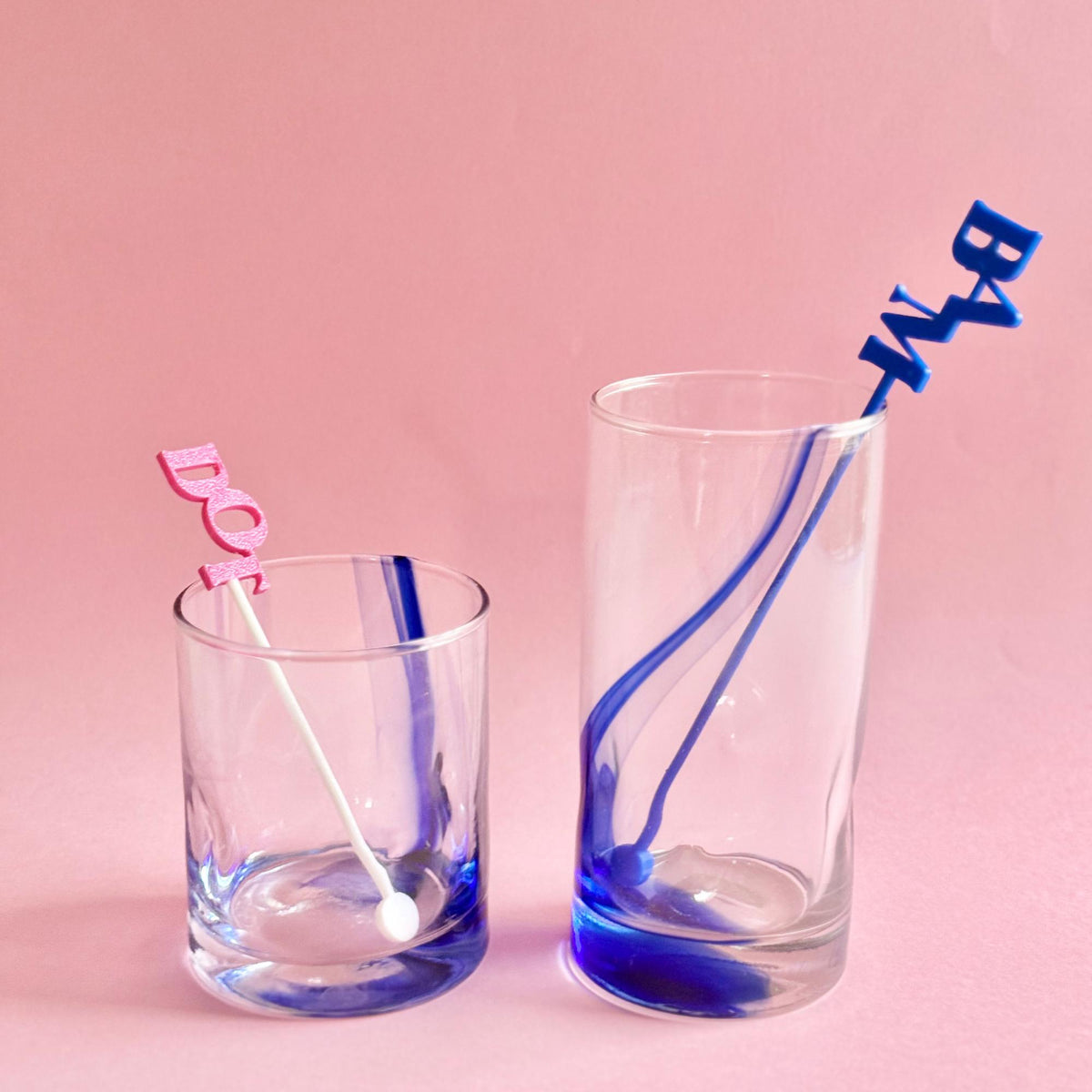 Mahjong stir sticks in glass tumblers