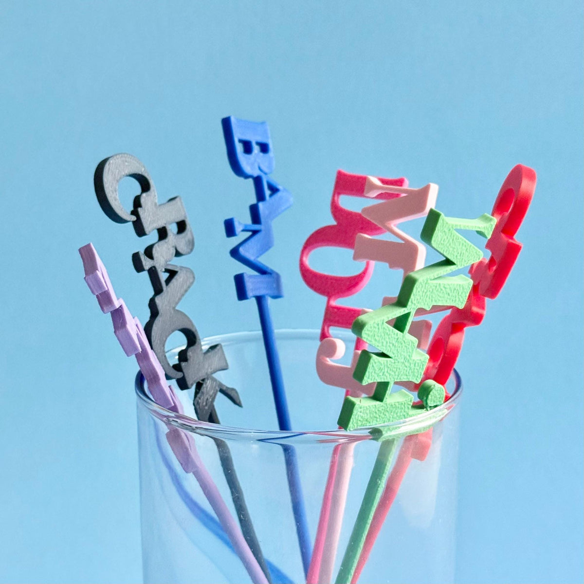 Colorful Mahjong drink stirrers with MAHJ, DOT, CRACK and BAM