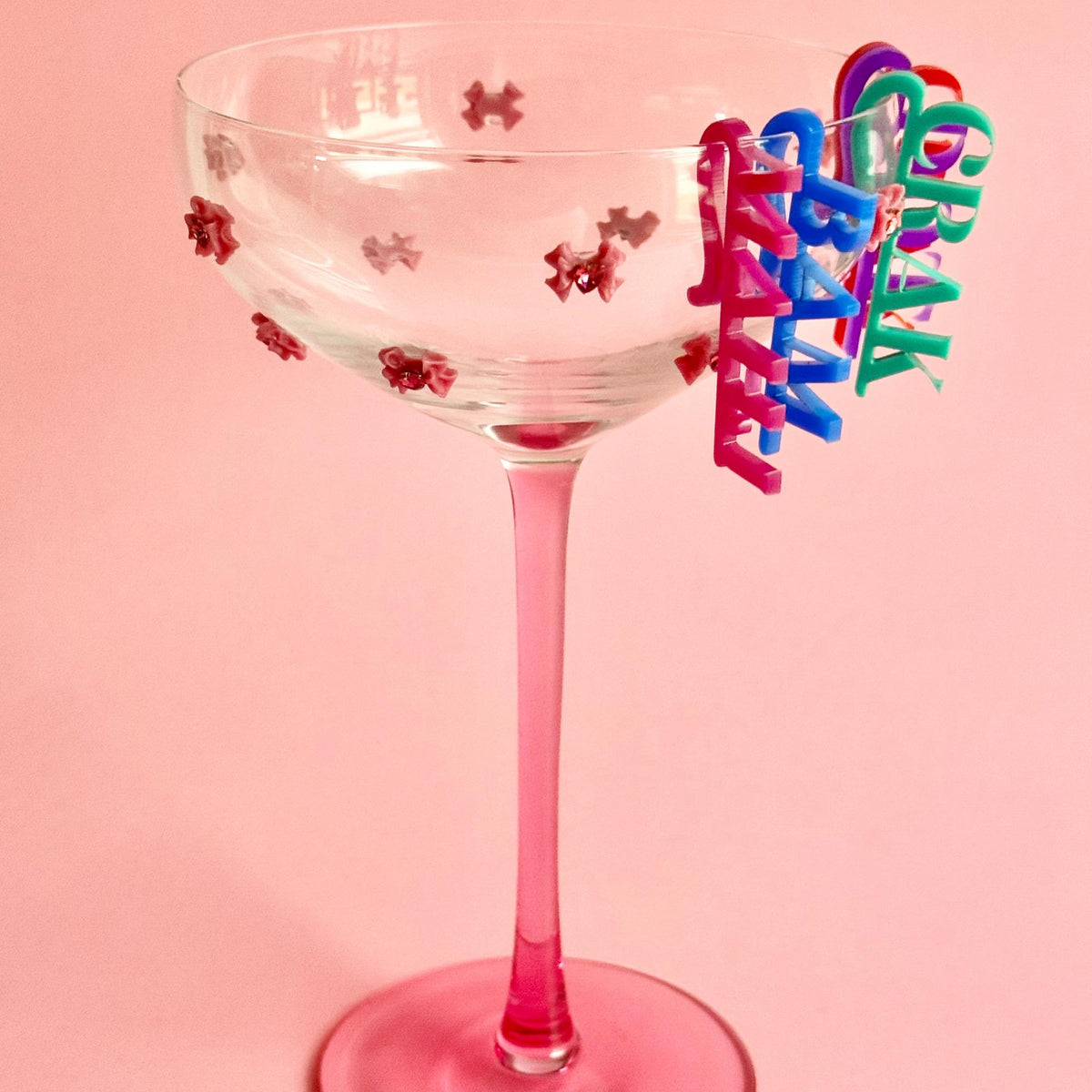 Mahjong wine charm on a cocktail glass
