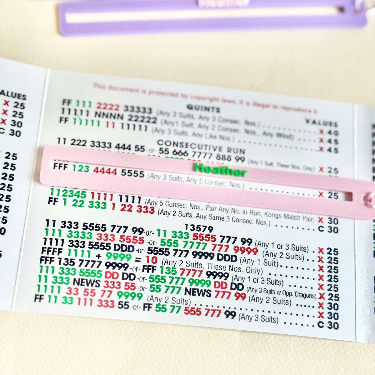 Pink personalized Mahjong line reader on the card