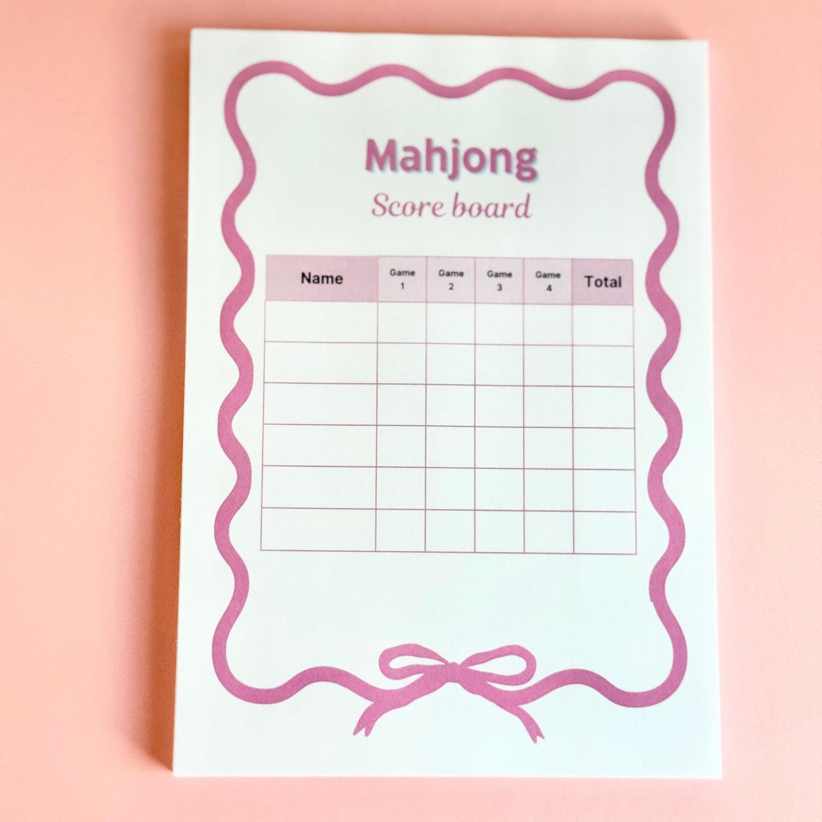 Mahjong score pad page with pink scalloped border