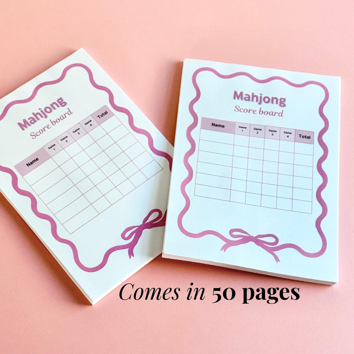 Two Mahjong scorecard notepads with pink accents