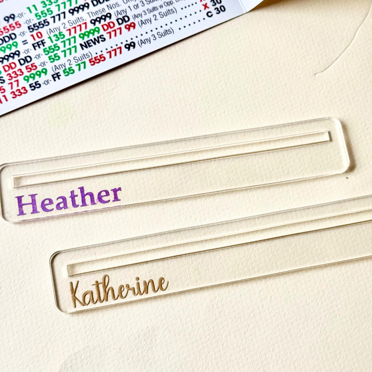 Two clear acrylic Mahjong line readers with script lettering