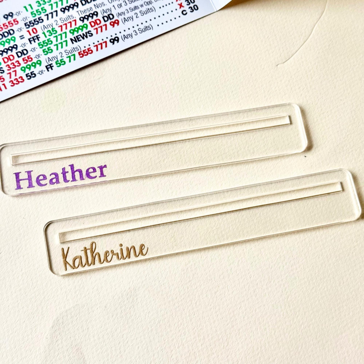 Clear acrylic mahjong line finder engraved with a name in purple paint fill