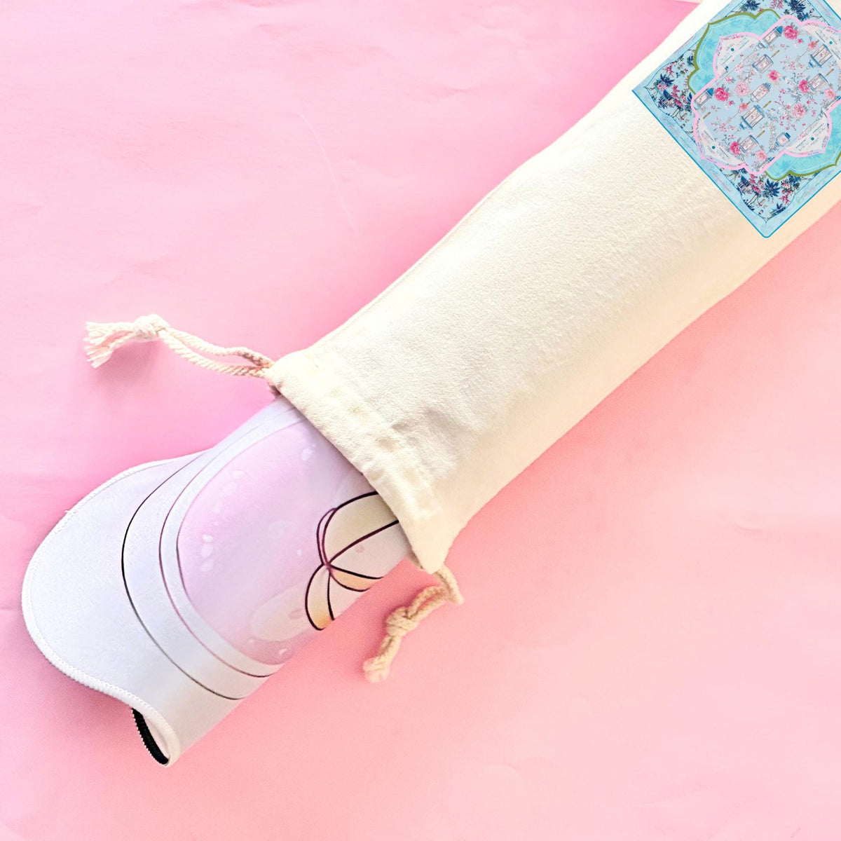 Cream canvas drawstring mahjong mat storage bag on pink background