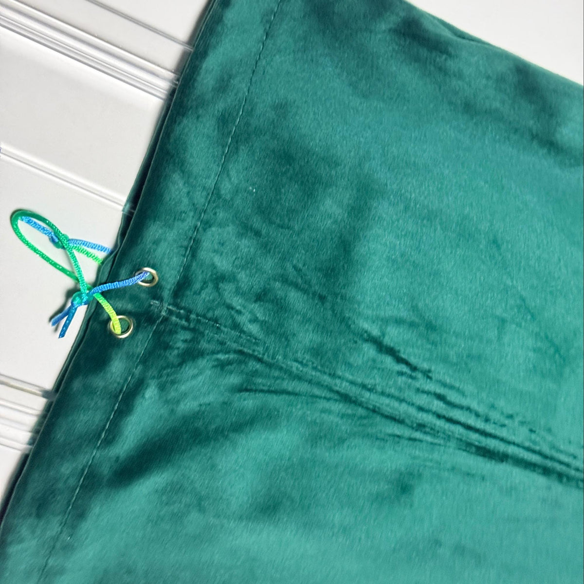 Emerald green velvet fabric close-up
