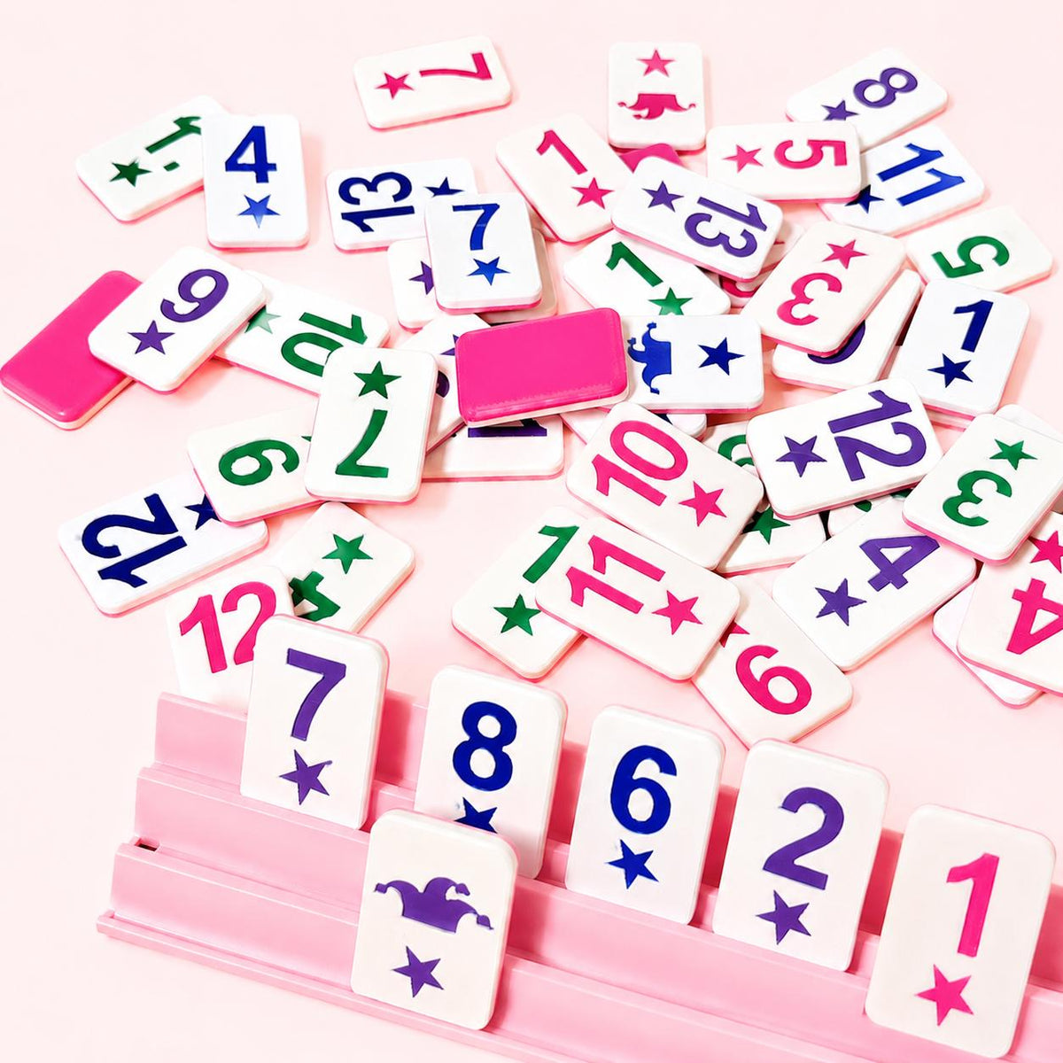 Personalized floating Rummikub tile set in pastel colors with racks and case